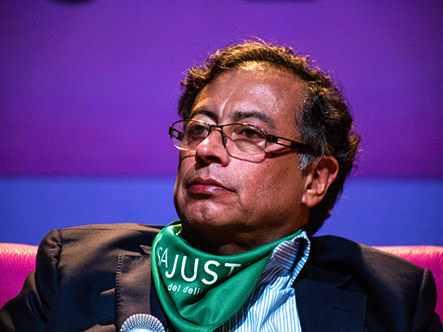 The candidate for the presidency of Colombia, Gustavo Petro, attends the debate with femin