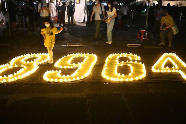 A child walks among the numbers "8964" during a vigil on the 33rd anniversary of the 1989 Tiananmen Square pro-democracy protests and crackdown, at the Chiang Kai-shek Memorial Hall in Taipei on June 4, 2022. (Photo by Sam Yeh / AFP) (Photo by SAM YEH/AFP via Getty Images)