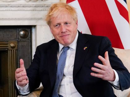 Britain's Prime Minister Boris Johnson gestures as he meets with Estonia's Prime Minister Kaja Kallas at the beginning of their meeting inside 10 Downing Street in central London on June 6, 2022. - British Prime Minister Boris Johnson faces a crunch Conservative Party confidence vote later Monday after 54 of …