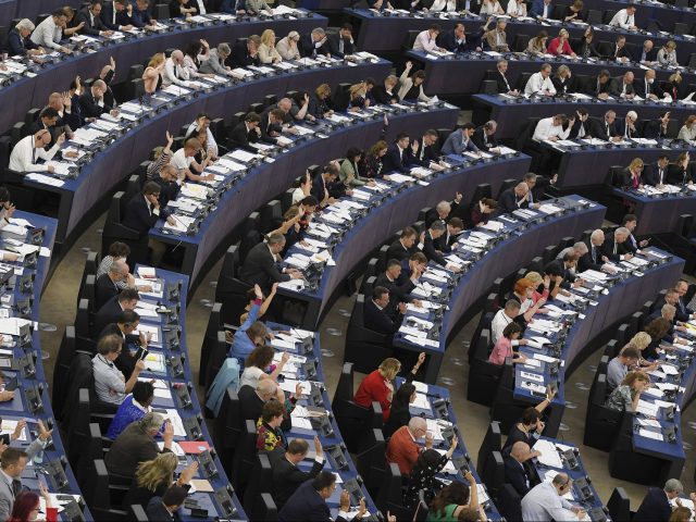 Members of the European Parliament take part in a voting session during a plenary session