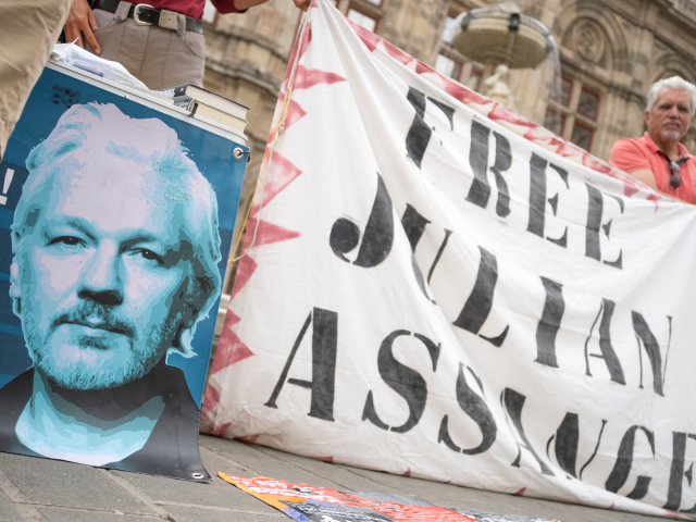Supporters of WikiLeaks founder Julian Assange attend a small protest near the State opera