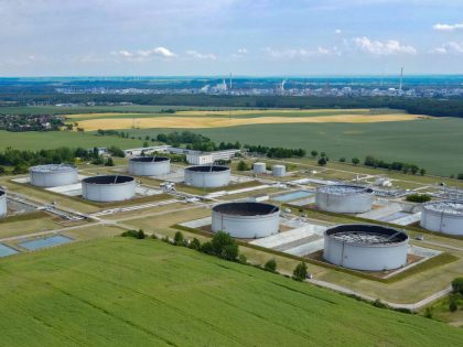 09 June 2022, Brandenburg, Schwedt/Oder: A tank farm for crude oil of PCK-Raffinerie GmbH (aerial view taken by drone). The German government is planning an import ban on Russian oil from next year, although the EU wants to exempt pipelines from the embargo. Russian oil arrives in Schwedt via the …