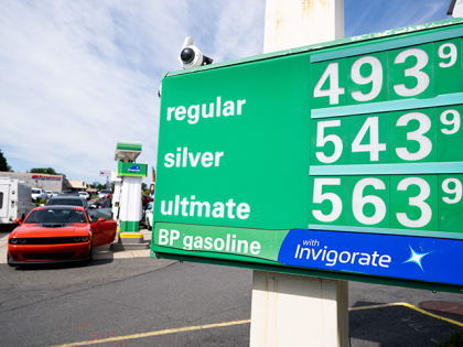 A sign displays the price of fuel at a gas station in McLean, Virginia, June 10, 2022. - Wall Street stocks fell sharply early on June 10 following fresh data showing surging consumer prices that quashed hopes inflation would quickly abate. Friday's report showed the consumer price index (CPI) jumped …