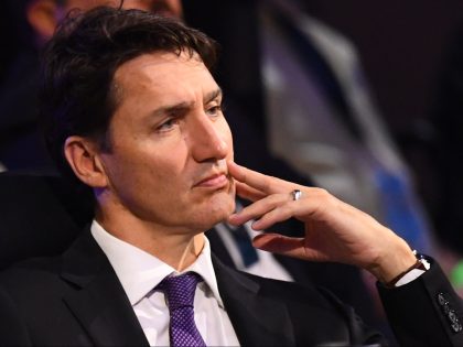 Canadian Prime Minister, Justin Trudeau, listens as he attends a plenary session of the 9t