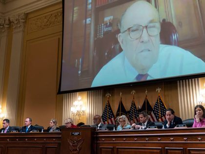 WASHINGTON, DC - JUNE 13: Video from a deposition with former President Trump advisor Rudy Giuliani is played during a House Select Committee to Investigate the January 6th hearing in the Cannon House Office Building on Monday, June 13, 2022 in Washington, DC. The bipartisan Select Committee to Investigate the …