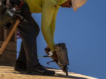 A contractor uses a nail gun on a home under construction in Antioch, California, US, on Tuesday, June 14, 2022. The number of home sellers lowering prices has reached the highest level since October 2019, the latest sign that the housing market is slowing from its once-frenzied pandemic pace. Photographer: …