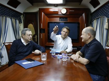 French President Emmanuel Macron (C), German Chancellor Olaf Scholz (R) and Italian Prime Minister Mario Draghi (L) travel on board a train bound to Kyiv after departing from Poland on June 16, 2022. - French President Emmanuel Macron, German Chancellor Olaf Scholz and Italian Prime Minister Mario Draghi left Poland …