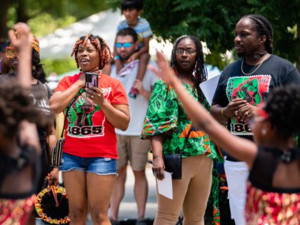 ATLANTA, GA - JUNE 18: Spectators watch the Juneteenth Atlanta Black History parade on Jun