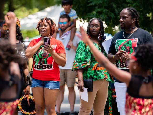 ATLANTA, GA - JUNE 18: Spectators watch the Juneteenth Atlanta Black History parade on Jun