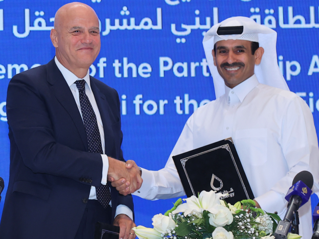 Qatar's Minister of State for Energy Affairs and President and CEO of QatarEnergy Saad Sherida al-Kaabi (R) shakes the hand of Claudio Descalzi, CEO of Italian multinational oil and gas company ENI, during a signing ceremony at the QatarEnergy headquarters in Doha on June 19, 2022. - Italian company Eni …