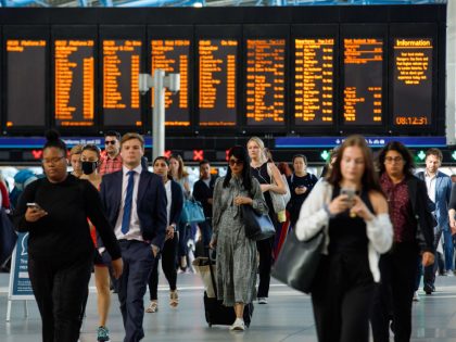 Commuters walk along the concourse after arriving at London Waterloo railway station in London, UK, on Monday, June 20, 2022. Britain's biggest train strike in 30 years is set to upend travel Tuesday as the world's oldest railroad struggles to redefine its role in a commuting landscape transformed by the …