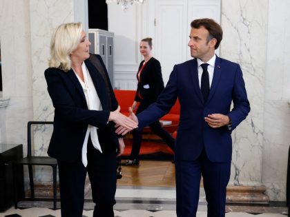 French far-right Rassemblement National (RN) leader and Member of Parliament Marine Le Pen (L) is escorted by France's President Emmanuel Macron after talks at the presidential Elysee Palace, in Paris, on June 21, 2022, two days after France's legislative elections. - France's President Emmanuel Macron hosts political party chiefs in …