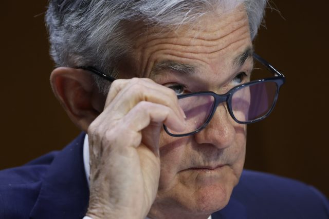 Jerome Powell, chairman of the US Federal Reserve, adjusts his glasses during a Senate Banking, Housing, and Urban Affairs Committee hearing in Washington, D.C., U.S., on Wednesday, June 22, 2022. Powell said the central bank will keep raising interest rates to tame inflation following the steepest hike in almost three …