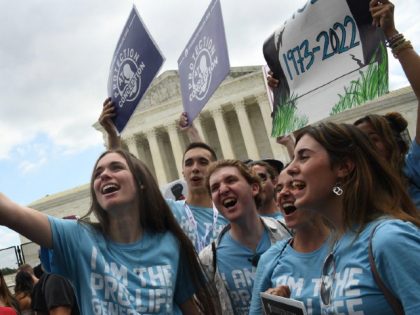 Pro-life supporters celebrate outside the US Supreme Court in Washington, DC, on June 24, 2022. - The US Supreme Court on Friday ended the right to abortion in a seismic ruling that shreds half a century of constitutional protections on one of the most divisive and bitterly fought issues in …