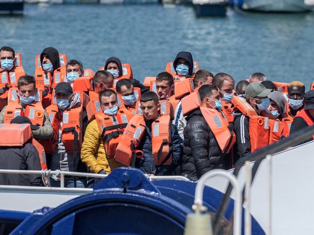 DOVER, UNITED KINGDOM - JUNE 24: The Border Force boat Typhoon escorts 50 migrants back to