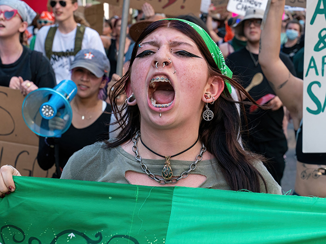 Abortion rights demonstrators march near the State Capitol in Austin, Texas, June 25, 2022. - Abortion rights defenders fanned out across America on June 25 for a second day of protest against the Supreme Court's thunderbolt ruling, as state after conservative state moved swiftly to ban the procedure. (Photo by …