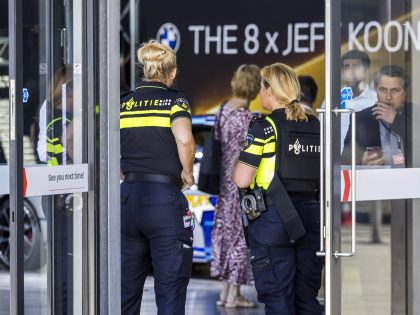 Dutch police officers stand guard at the entrance of the TEFAF Art Fair in Maastricht on June 28, 2022, following a robbery. - Armed robbers raided the TEFAF, one of the world's leading art fairs, in the Dutch city of Maastricht on June 28, 2022, police said, with video showing …