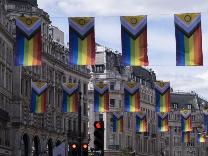 Intersex Inclusive Pride flags high above Regent Street in advance of the Pride in London parade on 28th June 2022 in London, United Kingdom. The flag includes stripes to represent LGBTQ+ communities, with colors from the Transgender Pride Flag, alongside the and circle of the Intersex flag. (photo by Mike …