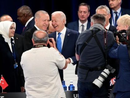 US President Joe Biden (3rd L) and Turkey's President Recep Tayyip Erdogan (2nd L) pose for photographers as they arrive at the first plenary session of the NATO summit at the Ifema congress centre in Madrid, on June 29, 2022. (Photo by BERTRAND GUAY / POOL / AFP) (Photo by …