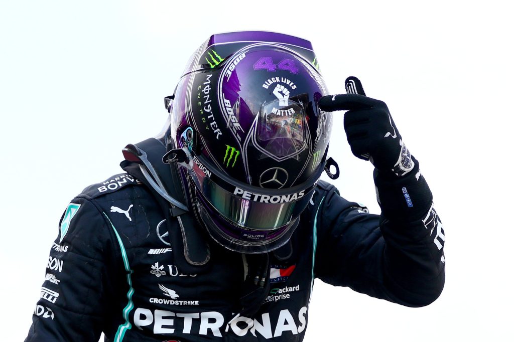 Race winner Lewis Hamilton of Great Britain and Mercedes GP points to the 'Black Lives Matter' symbol on his helmet as he celebrates in parc ferme during the F1 Grand Prix of Spain at Circuit de Barcelona-Catalunya on August 16, 2020 in Barcelona, Spain. (Photo by Dan Istitene - Formula 1/Formula 1 via Getty Images)