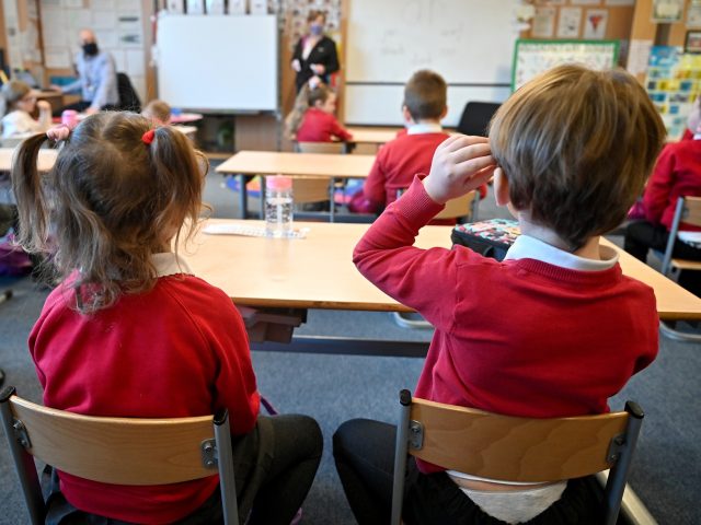 GLASGOW, SCOTLAND - FEBRUARY 22: Pupils at Cleeves Primary School return to the classroom on February 22, 2021 in Glasgow, Scotland. The phased return of P1 to P3 pupils to the classroom started this morning, other age groups will continue to learn from home, apart from some secondary pupils who …