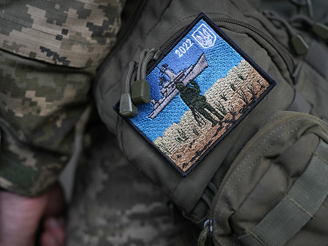 A Ukrainian soldier wears a "Snake Island" embroidered badge on his uniform comm