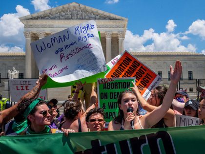 WASHINGTON, DC - JUNE 25: Abortion-rights activists attempt to block a disrupter as a woman speaks to a crowd in front of the U.S. Supreme Court on June 25, 2022 in Washington, DC. The Supreme Court's decision in Dobbs v Jackson Women's Health overturned the landmark 50-year-old Roe v Wade …