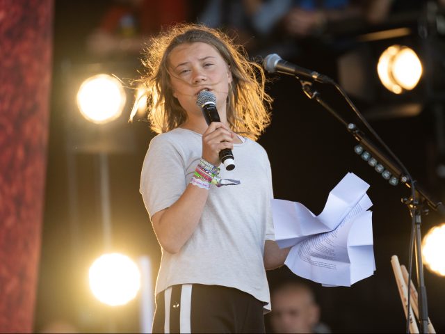 GLASTONBURY, ENGLAND - JUNE 25: Greta Thunberg addresses the crowd from The Pyramid Stage during day four of Glastonbury Festival at Worthy Farm, Pilton on June 25, 2022 in Glastonbury, England. (Photo by Harry Durrant/Getty Images)
