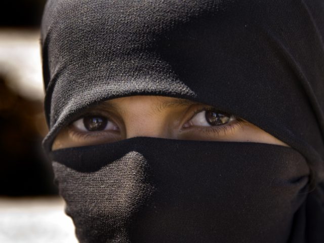 [UNVERIFIED CONTENT] Portrait of the intense gaze of an Arab girl wearing a black veil o niqab, Kahel, Haraz Mountains, Yemen