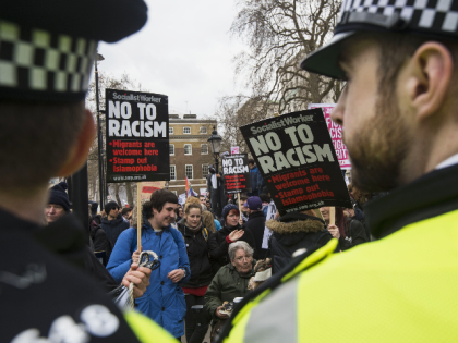 A police cordon stops counter-protesters marching against a rally by the British off-shoot of the Germany-based PEGIDA movement on Whitehall in central London on April 4, 2015. PEGIDA stands for the Patriotic Europeans Against the Islamisation of the West. An estimated 150 counter-protesters outnumbered the PEGIDA protest opposite Downing Street …