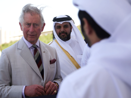 DOHA, QATAR - FEBRUARY 20: Britain's Prince Charles (L) arrives Doha, Qatar on February 20, 2014. Prince Charles chats to young Qatari environmentalists in the Museum of Islamic Arts Park in Doha, Qatar. The Prince is on a three day solo visit to Qatar following a short visit to Saudi …