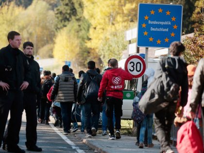 PASSAU, GERMANY - OCTOBER 28: Migrants cross the German border to Austria on October 28, 2015 near Wegscheid, Germany. Bavarian Governor Horst Seehofer has accused the Austrian government of wantonly shuttling migrants in buses from the Slovenian border across Austria and dumping them at all hours of day and night …