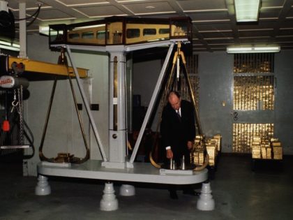 (Original Caption) New York, N.Y.: Gold bars are weighed on a giant scale in the gold vault of the Federal Reserve Bank, where $15 billion worth of gold is kept