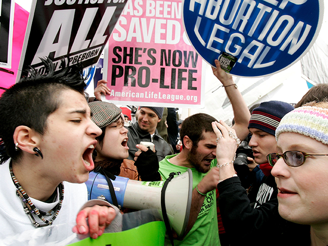 Pro-choice activists (L) argue with Pro-life activists (R) on abortion issues in front of the U.S. Supreme Court January 23, 2006 in Washington, DC. Thousands of people took part in the annual ?March for Life? event to mark the 33rd anniversary of the Roe v. Wade ruling that legalized abortion. …