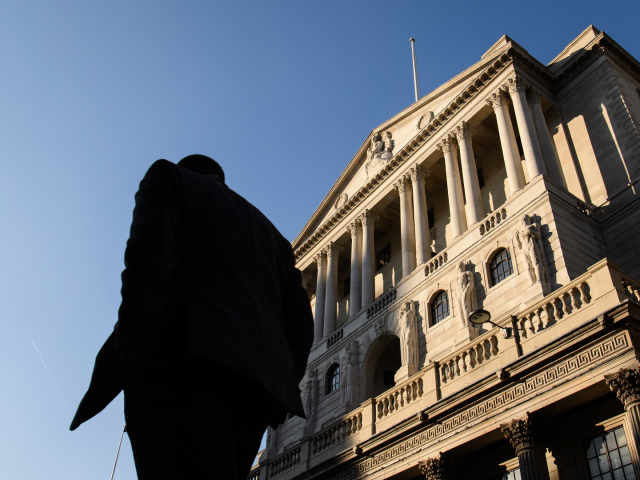 LONDON, ENGLAND - JANUARY 24: City workers walk past the Bank of England, in the financial