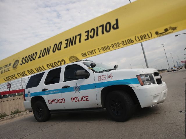 CHICAGO, IL - JUNE 30: Police investigate the murder of a young man found shot to death in the back seat of a bullet-riddled car on June 30, 2017 in Chicago, Illinois. More than 300 people have been killed and more than 1700 wounded by gunfire in Chicago this year. …