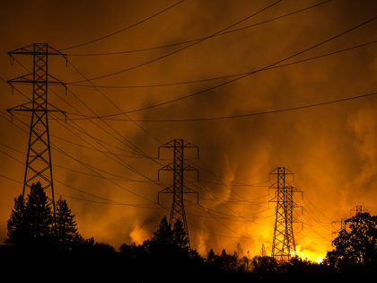 A firestorm that began in Napa Valley's Calistoga, roars down the hills from Fountaingrove