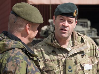 SALISBURY, ENGLAND - MAY 03: Lieutenant General Patrick Sanders, Commander Field Army (R) talks at a live demonstration at the Joint Expeditionary Force (JEF) Live Exercise (LIVEX) Distinguished Visitor Day being held on Salisbury Plain Training Area near Salisbury on May 3, 2018 in Wiltshire, England. The JEF LIVEX, attended …