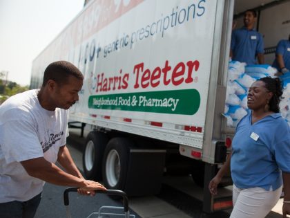 BETHESDA, MD - JULY 1: Earlene Sawyer and other Harris Teeter employees hand out free bags