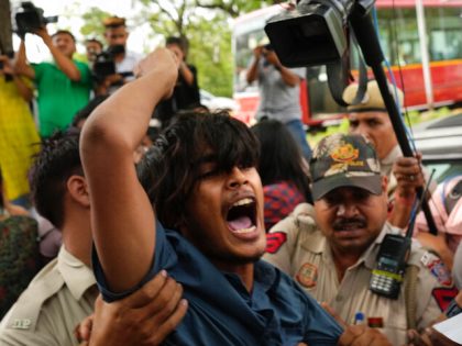 A Muslim student is detained during a protest outside Uttar Pradesh house, in New Delhi, Monday, June 13, 2022. The students were protesting against persecution of Muslims and recent demolition of their houses following last week's protests against former Bharatiya Janata Party spokesperson Nupur Sharma's remark deemed derogatory to Islam's …
