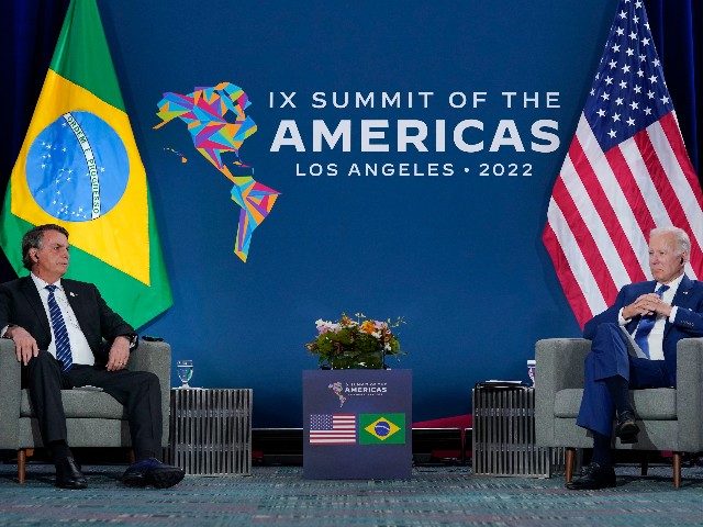 President Joe Biden, right, meets with Brazilian President Jair Bolsonaro during the Summi