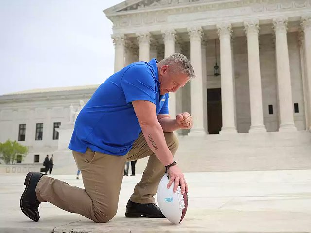 WASHINGTON, DC - APRIL 25: Former Bremerton High School assistant football coach Joe Kennedy takes a knee in front of the U.S. Supreme Court after his legal case, Kennedy vs. Bremerton School District, was argued before the court on April 25, 2022 in Washington, DC. Kennedy was terminated from his …