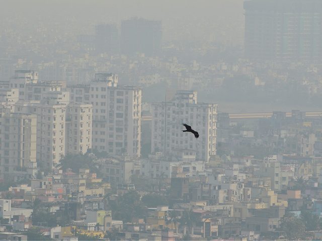 A bird flies through the heavy smog in Kolkata, India, 18 December, 2021. Today's AQI (Air Quality Index) level in Kolkata is 250 (Approx). Indo-Gangetic plain cities, including Delhi, Lucknow, Patna and Kolkata, accounted for more than 43% deaths due to pollution from PM2.5 concentrations according to an Indian media …