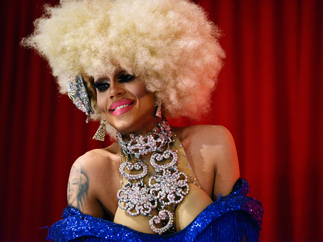 VIDEO: Young Child Tips Drag Queen with Exposed Fake Breasts at Bar - Vimarsana News