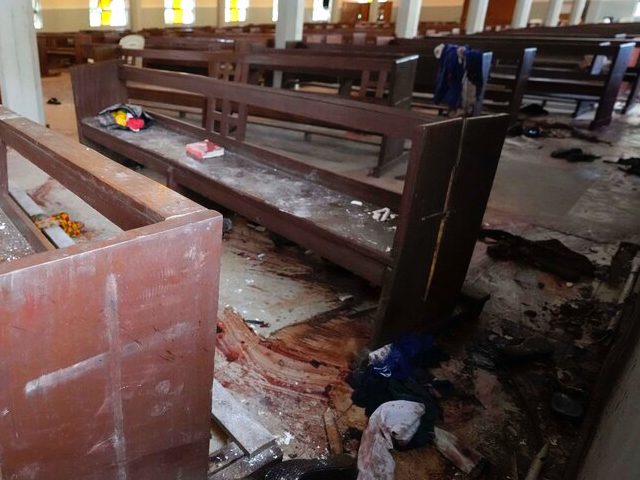 Personal belongings and shoes lie on the ground of St. Francis Catholic Church in Owo, Nig