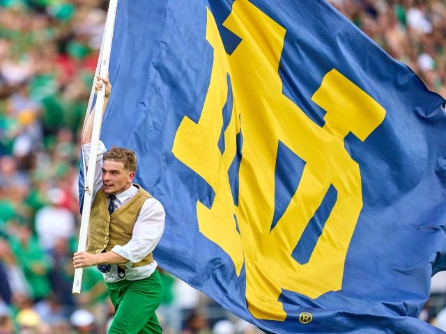 Notre Dame mascot and flag
