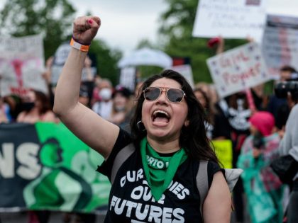 WASHINGTON, DC - MAY 14: Abortion-rights demonstrators yell as they walk down Constitution Avenue during the Bans Off Our Bodies march on May 14, 2022 in Washington, DC. Abortion rights supporters are holding rallies around the country urging lawmakers to affirm abortion rights into law after a leaked draft from …