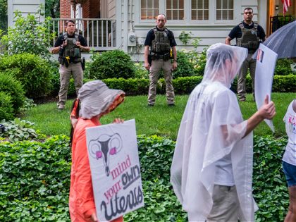CHEVY CHASE, MD - JUNE 08: Protesters march past Supreme Court Justice Brett Kavanaugh's home on June 8, 2022 in Chevy Chase, Maryland. An armed man was arrested near Kavanaugh's home Wednesday morning as the court prepares to announce decisions for about 30 cases. (Photo by Nathan Howard/Getty Images)