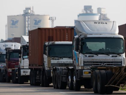 A line of trucks parked as a protest at the Uiwang Inland Container Depot in Uiwang, South Korea, on Friday, June 10, 2022. Thousands of truck drivers who are seeking to prevent a change to wage rules have gone on strike at major ports and container depots, posing the latest …