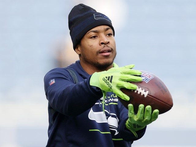 SEATTLE, WASHINGTON - DECEMBER 5: Tyler Lockett, #16 of the Seattle Seahawks, warms up before the game against the San Francisco 49ers at Lumen Field on December 5, 2021, in Seattle, Washington.